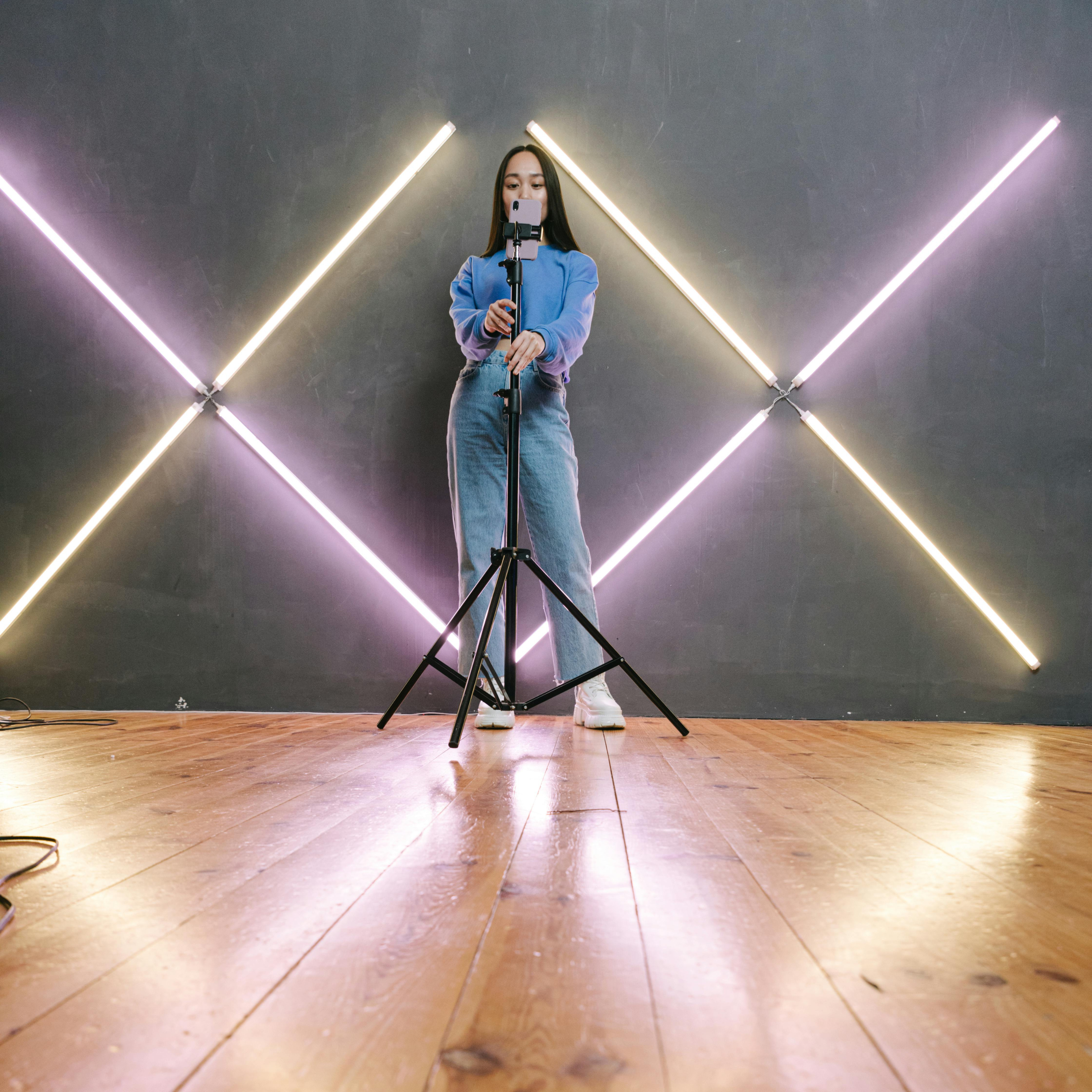 A person standing on top of a wooden floor.